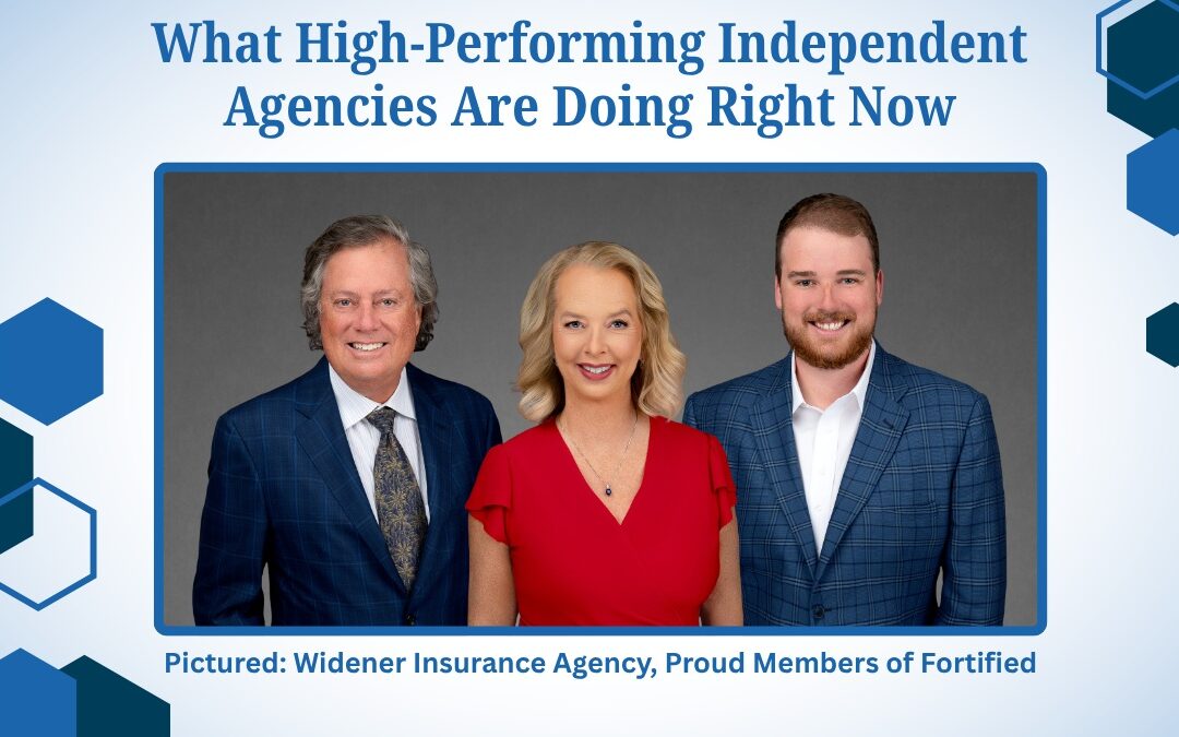 Three individuals in formal suits and ties standing closely together, smiling at the camera. - www.fortifiedagencies.com